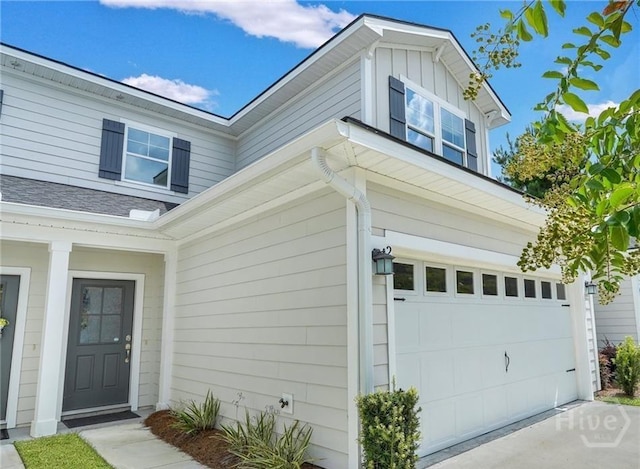 20 Lower Creek Dr, Richmond Hill, GA 31324 - view of home's exterior with a garage, concrete driveway, and board and batten siding