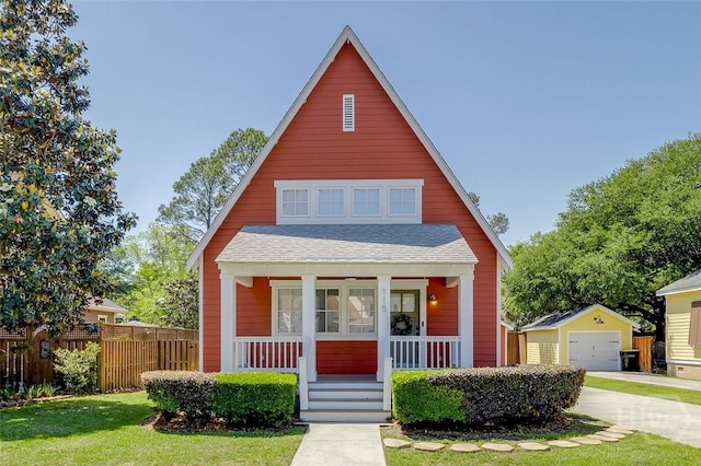 115 Daisy Ct, Savannah, GA 31404 - bungalow-style home featuring a porch, a detached garage, an outbuilding, driveway, and roof with shingles