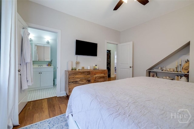 115 Daisy Ct, Savannah, GA 31404 - bedroom with dark wood-style floors, ensuite bathroom, a ceiling fan, a sink, and baseboards