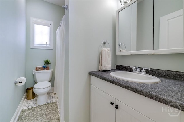 115 Daisy Ct, Savannah, GA 31404 - bathroom with vanity, toilet, tile patterned floors, and baseboards