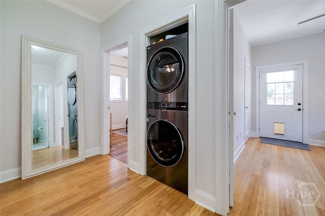 115 Daisy Ct, Savannah, GA 31404 - laundry area with stacked washer / dryer, light wood finished floors, ornamental molding, baseboards, and a ceiling fan