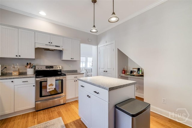 115 Daisy Ct, Savannah, GA 31404 - kitchen with electric stove, under cabinet range hood, crown molding, light wood-type flooring, and hanging light fixtures