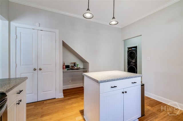 115 Daisy Ct, Savannah, GA 31404 - kitchen featuring ornamental molding, light wood-type flooring, white cabinets, hanging light fixtures, and baseboards