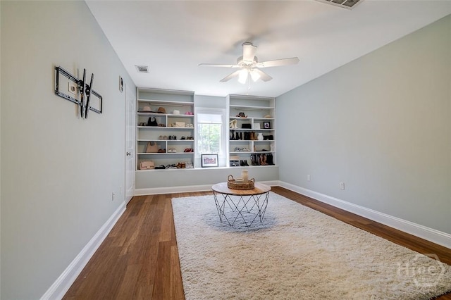 115 Daisy Ct, Savannah, GA 31404 - sitting room with dark wood-style flooring, a ceiling fan, baseboards, and built in shelves