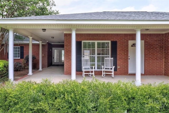 101 Coldbrook Cir, Rincon, GA 31326 - property entrance with brick siding, a porch, and roof with shingles