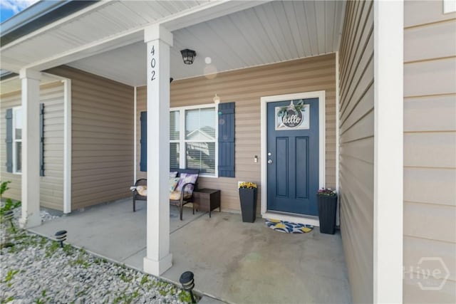 402 Abode Ave, Hinesville, GA 31313 - view of exterior entry with a porch