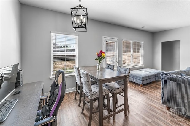 402 Abode Ave, Hinesville, GA 31313 - dining area with a chandelier and wood finished floors
