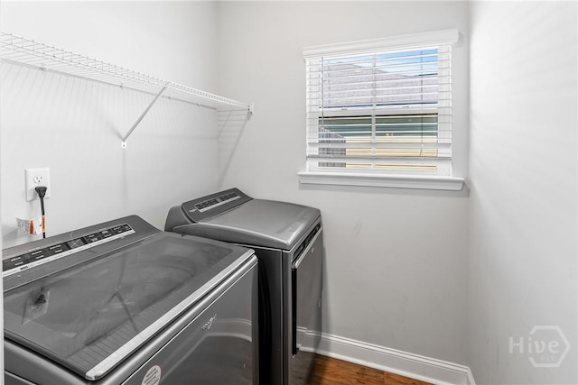 402 Abode Ave, Hinesville, GA 31313 - washroom with washer and clothes dryer, baseboards, and dark wood-style floors