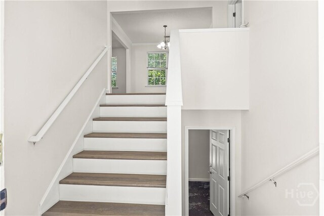 303 Aspen, Rincon, GA 31326 - stairway featuring wood finished floors, a chandelier, and ornamental molding
