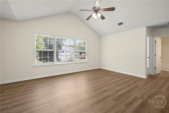 303 Aspen, Rincon, GA 31326 - spare room featuring a ceiling fan, wood finished floors, vaulted ceiling, and baseboards