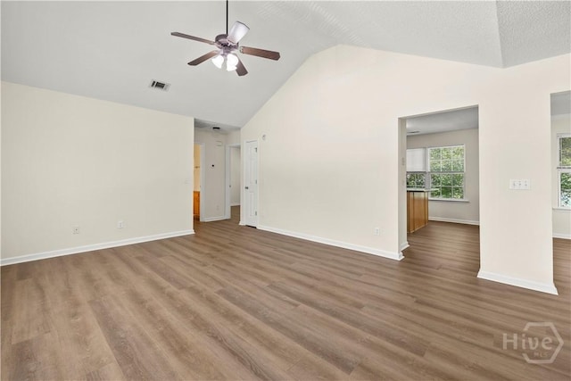 303 Aspen, Rincon, GA 31326 - unfurnished living room featuring a ceiling fan, vaulted ceiling, baseboards, and wood finished floors
