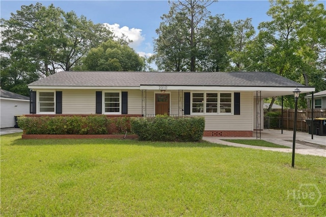 2310 Toussaint Ave, Savannah, GA 31404 - view of front facade with an attached carport and driveway