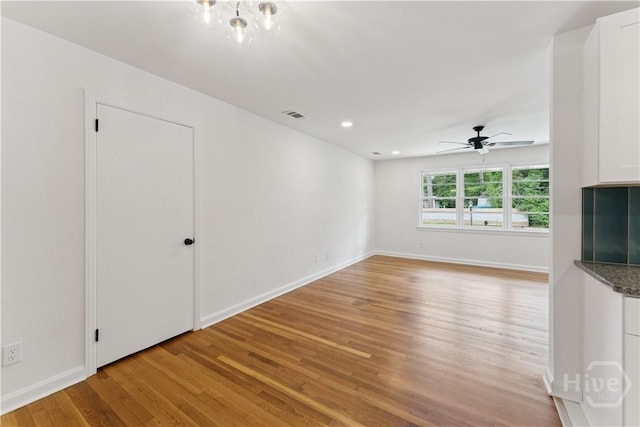 2310 Toussaint Ave, Savannah, GA 31404 - unfurnished living room with light wood finished floors, ceiling fan, baseboards, and recessed lighting