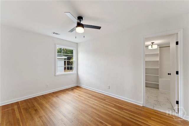 2310 Toussaint Ave, Savannah, GA 31404 - spare room with ceiling fan, baseboards, and wood finished floors