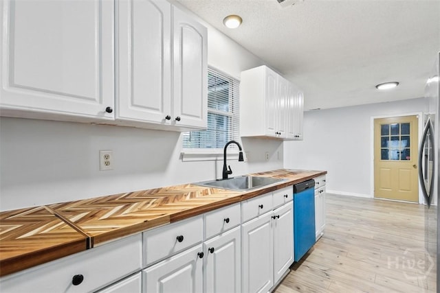 17 Walthour Cv, Savannah, GA 31410 - kitchen featuring dishwasher, a sink, butcher block countertops, white cabinets, and freestanding refrigerator