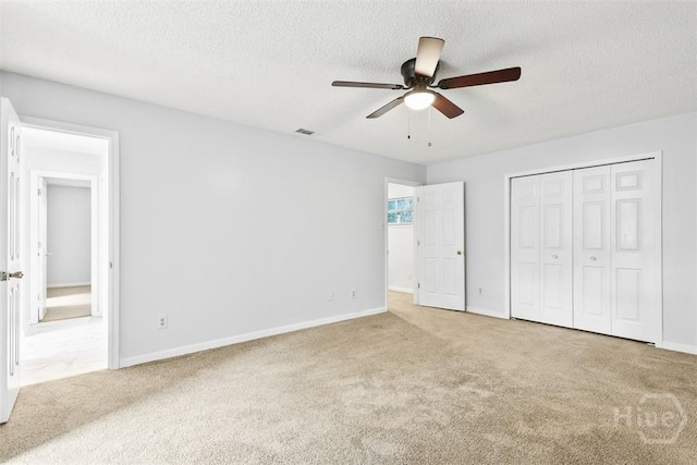 17 Walthour Cv, Savannah, GA 31410 - unfurnished bedroom with carpet flooring, a textured ceiling, baseboards, and a closet