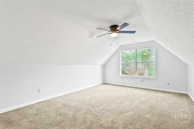 17 Walthour Cv, Savannah, GA 31410 - additional living space with a textured ceiling, carpet, vaulted ceiling, ceiling fan, and baseboards