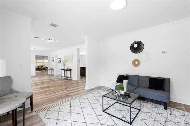 550 Brogdon Rd, Guyton, GA 31312 - living room featuring light wood-style floors, ornamental molding, and baseboards