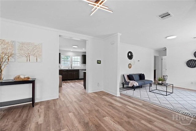 550 Brogdon Rd, Guyton, GA 31312 - sitting room with light wood finished floors, ornamental molding, and baseboards