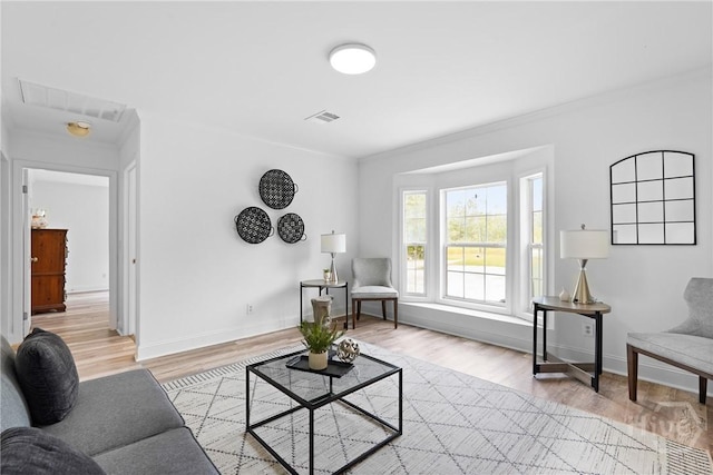 550 Brogdon Rd, Guyton, GA 31312 - living room with light wood-style flooring, baseboards, and crown molding