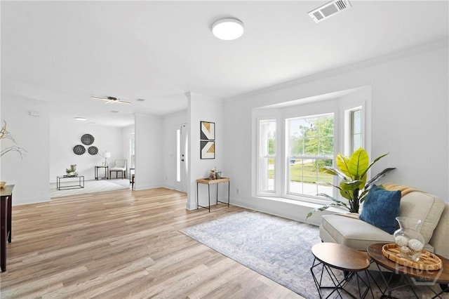550 Brogdon Rd, Guyton, GA 31312 - living area with light wood finished floors, baseboards, and crown molding