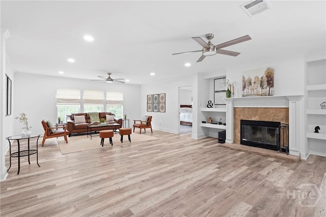 550 Brogdon Rd, Guyton, GA 31312 - living room with ceiling fan, baseboards, recessed lighting, built in features, and light wood-type flooring