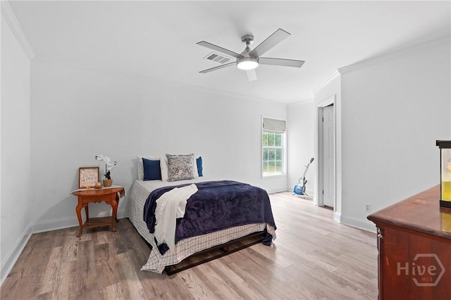 550 Brogdon Rd, Guyton, GA 31312 - bedroom with ornamental molding, light wood-style flooring, baseboards, and ceiling fan