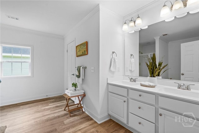 550 Brogdon Rd, Guyton, GA 31312 - full bath with double vanity, wood finished floors, crown molding, baseboards, and a shower
