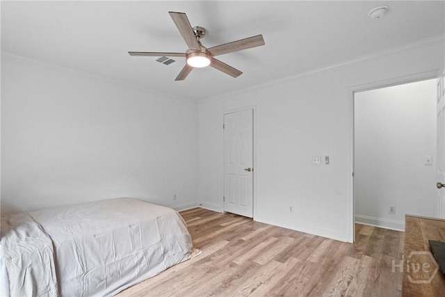 550 Brogdon Rd, Guyton, GA 31312 - unfurnished bedroom with ornamental molding, wood finished floors, baseboards, and a ceiling fan