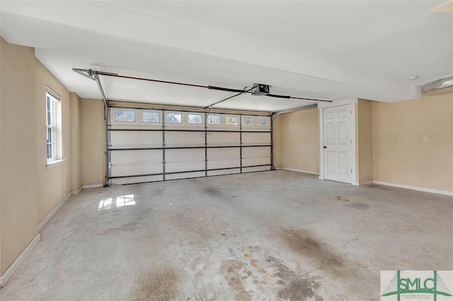 1056 Fiddler Trce, Townsend, GA 31331 - garage featuring a garage door opener and baseboards