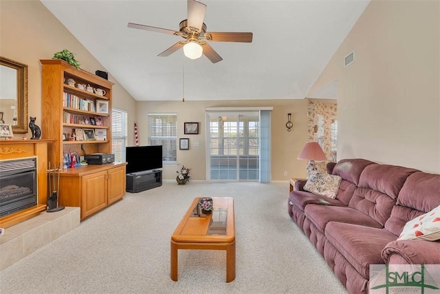 1056 Fiddler Trce, Townsend, GA 31331 - living room with a ceiling fan, light carpet, a fireplace, baseboards, and high vaulted ceiling