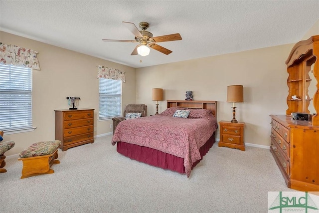 1056 Fiddler Trce, Townsend, GA 31331 - bedroom featuring multiple windows, light colored carpet, a textured ceiling, and baseboards