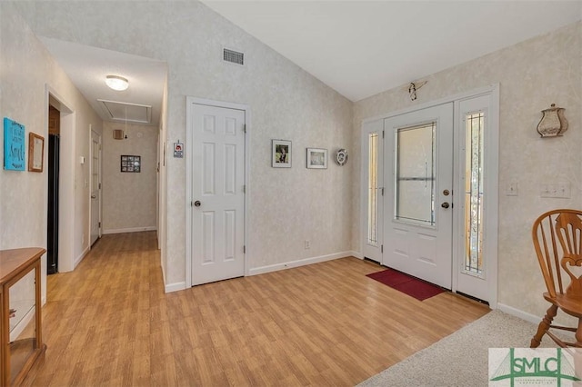 1056 Fiddler Trce, Townsend, GA 31331 - entryway featuring vaulted ceiling, light wood-style floors, and baseboards