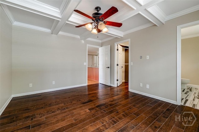 428 Roberts Way, Rincon, GA 31326 - unfurnished bedroom with coffered ceiling, dark wood-type flooring, baseboards, beam ceiling, and a walk in closet