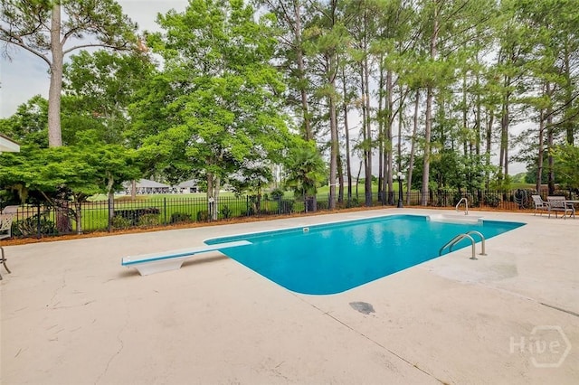 428 Roberts Way, Rincon, GA 31326 - view of pool featuring a patio area, a diving board, and view of scattered trees