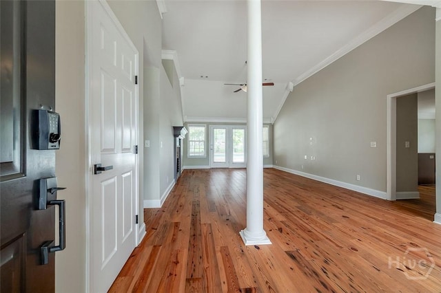 428 Roberts Way, Rincon, GA 31326 - unfurnished living room with ornamental molding, light wood-style flooring, ornate columns, ceiling fan, and baseboards