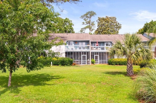 226 Bull River Bluff Dr, Savannah, GA 31410 - back of property featuring a balcony, a sunroom, and a lawn