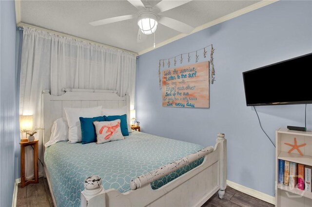 1217 Bay St Unit 105B, Tybee Island, GA 31328 - bedroom with wood finished floors and a ceiling fan