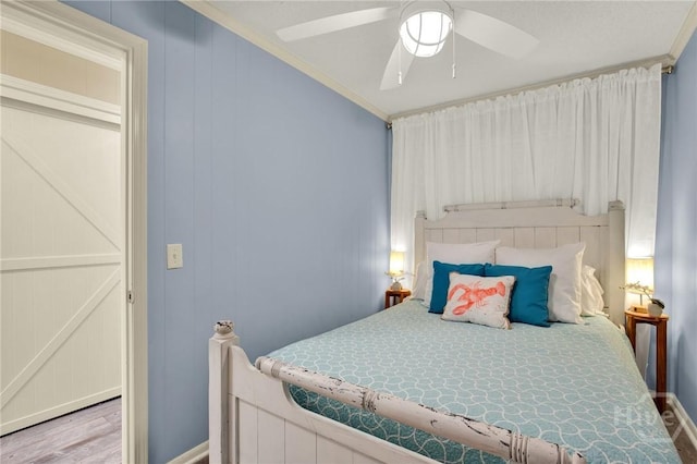 1217 Bay St Unit 105B, Tybee Island, GA 31328 - bedroom featuring crown molding, wood finished floors, and ceiling fan