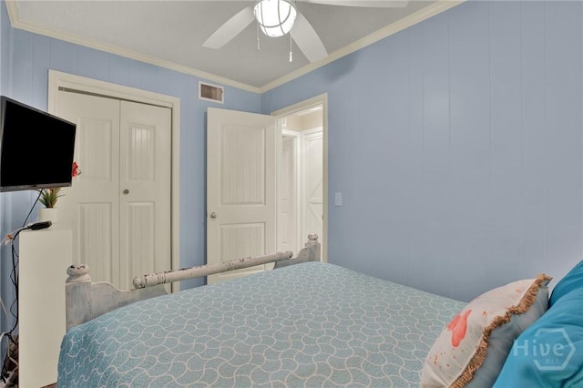 1217 Bay St Unit 105B, Tybee Island, GA 31328 - bedroom featuring crown molding, ceiling fan, and a closet