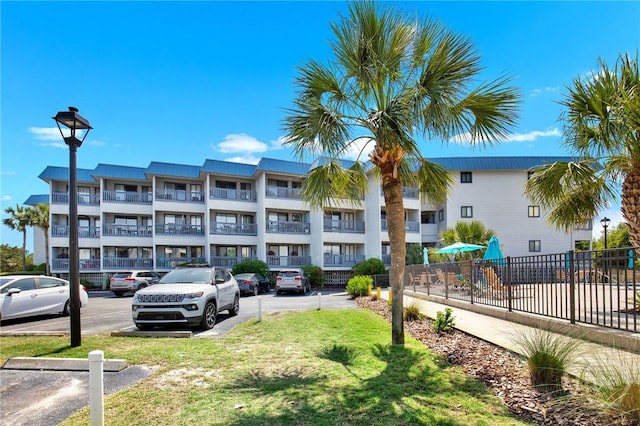 1217 Bay St Unit 105B, Tybee Island, GA 31328 - view of apartment building / complex with uncovered parking