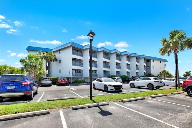 1217 Bay St Unit 105B, Tybee Island, GA 31328 - view of apartment building / complex with uncovered parking