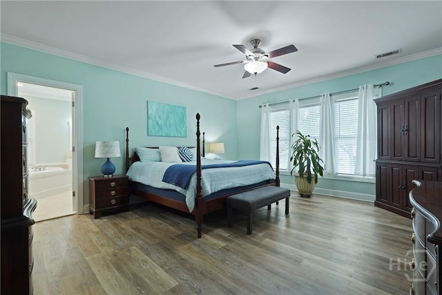 8813 Whitefield Ave, Savannah, GA 31406 - bedroom with light wood-type flooring, crown molding, baseboards, ceiling fan, and connected bathroom