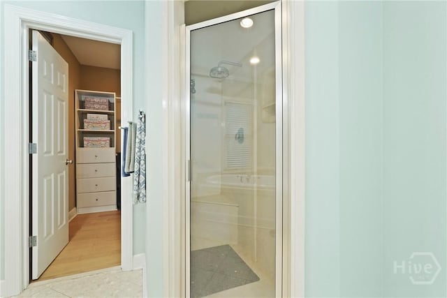 8813 Whitefield Ave, Savannah, GA 31406 - bathroom featuring a stall shower, baseboards, and tile patterned floors