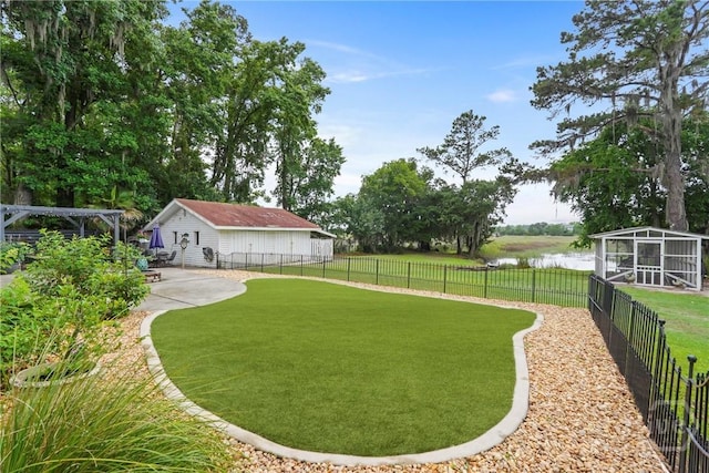 8813 Whitefield Ave, Savannah, GA 31406 - view of yard with a water view, an outbuilding, and a patio area