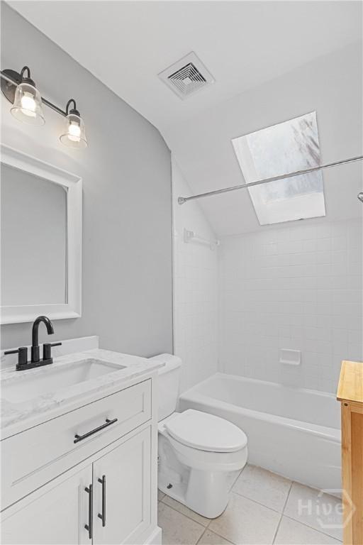 67 Oak Side Ct, Richmond Hill, GA 31324 - bathroom featuring vanity, vaulted ceiling, toilet, shower / bathtub combination, and tile patterned flooring