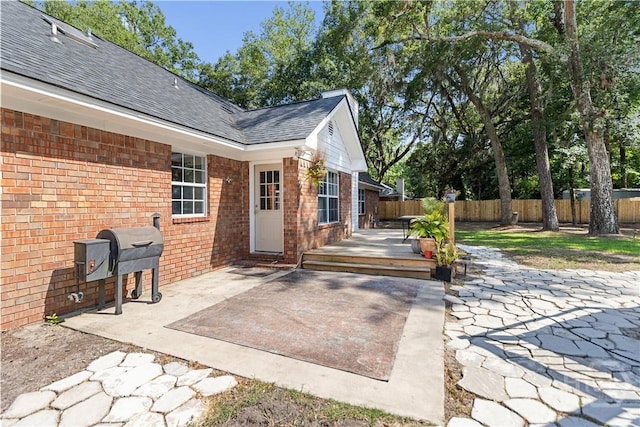 67 Oak Side Ct, Richmond Hill, GA 31324 - fenced backyard featuring a deck, a patio, and area for grilling