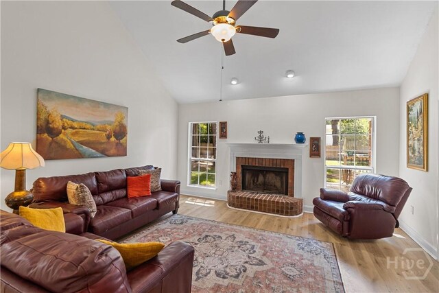 67 Oak Side Ct, Richmond Hill, GA 31324 - living room with wood finished floors, plenty of natural light, a ceiling fan, baseboards, and high vaulted ceiling