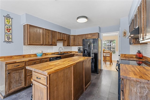67 Oak Side Ct, Richmond Hill, GA 31324 - kitchen featuring wood counters, black fridge with ice dispenser, a sink, and under cabinet range hood