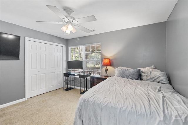 67 Oak Side Ct, Richmond Hill, GA 31324 - bedroom with light carpet, a ceiling fan, baseboards, and a closet